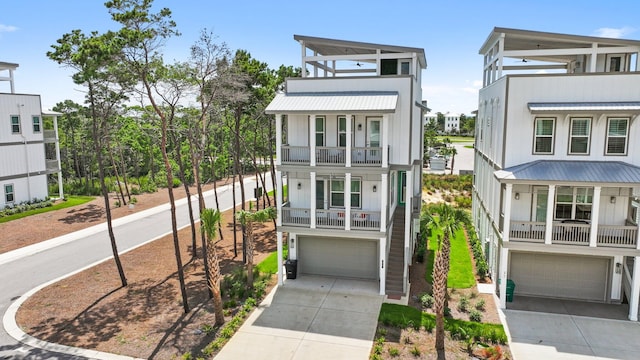 view of front of home featuring a garage and a balcony