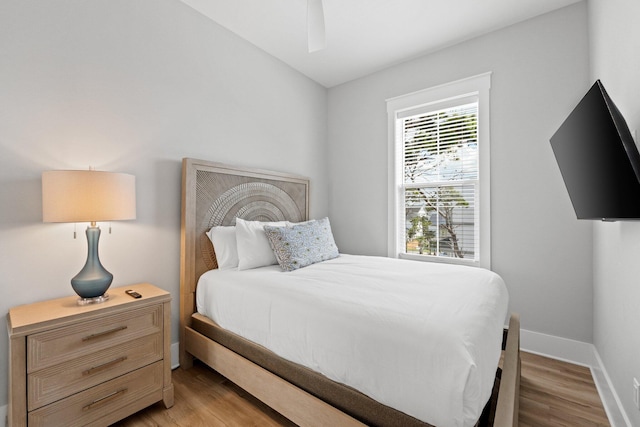 bedroom featuring light wood-type flooring and ceiling fan