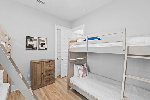 bedroom with light wood-type flooring