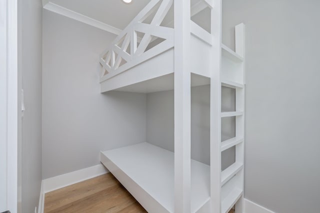 bedroom with hardwood / wood-style flooring