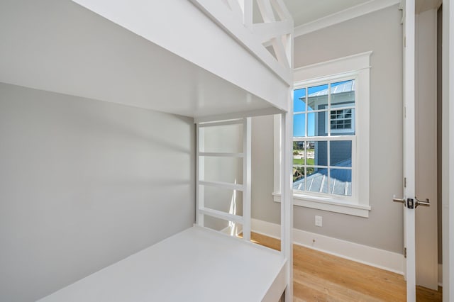 bedroom with hardwood / wood-style floors