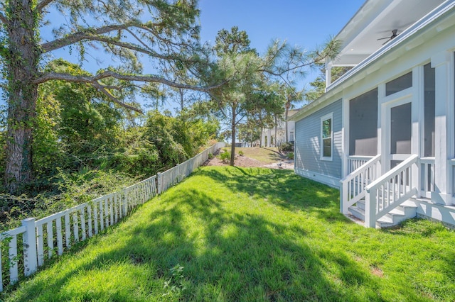 view of yard featuring a sunroom