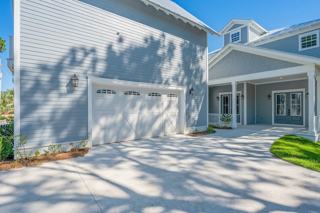 view of front facade with covered porch and a garage