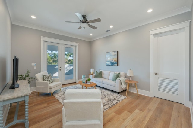 living room with french doors, light hardwood / wood-style flooring, ceiling fan, and ornamental molding