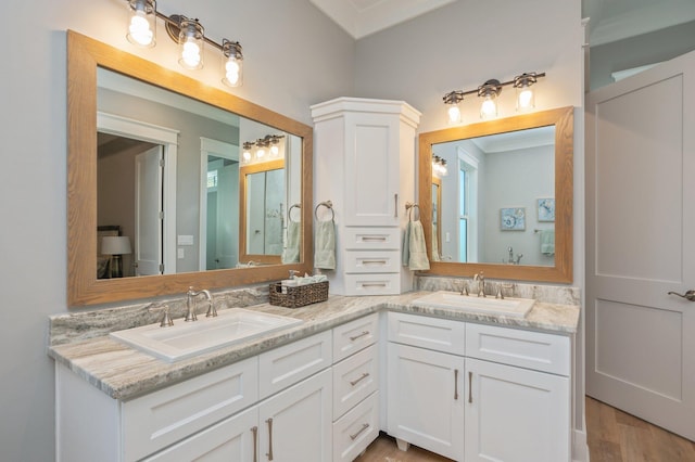 bathroom with vanity and hardwood / wood-style flooring