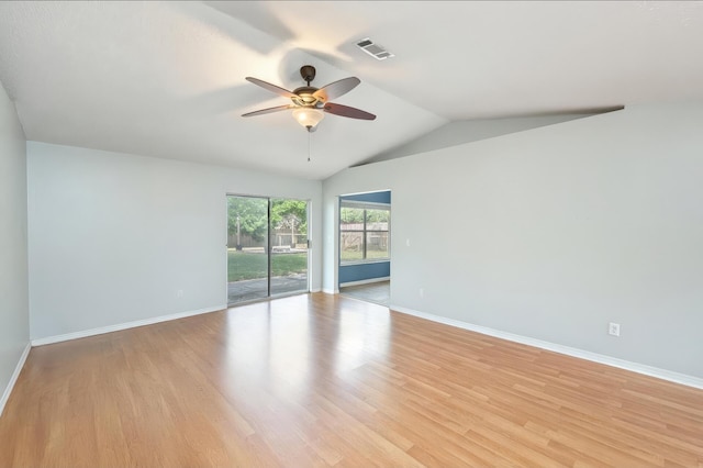 spare room with baseboards, ceiling fan, visible vents, and light wood-style floors