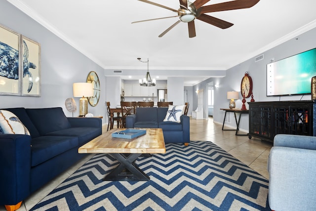 tiled living room with ornamental molding and ceiling fan with notable chandelier