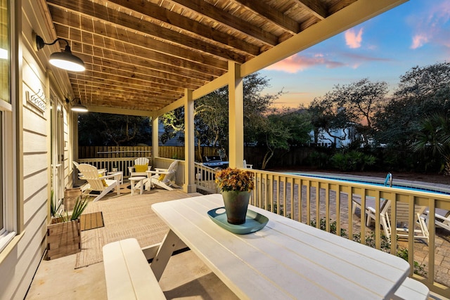 view of patio terrace at dusk