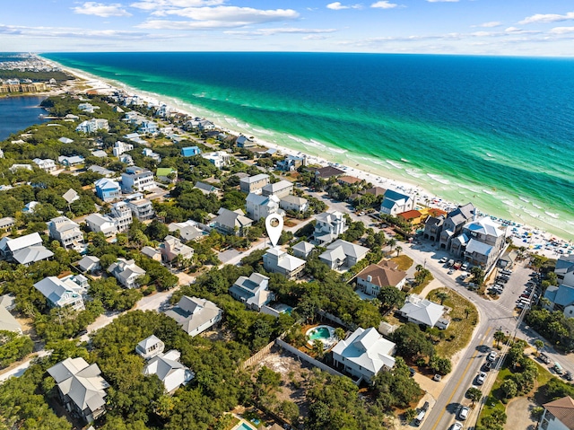 bird's eye view with a water view and a view of the beach