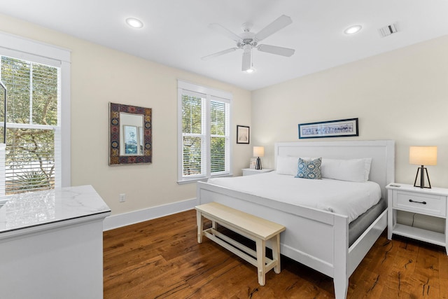 bedroom with ceiling fan and dark hardwood / wood-style floors