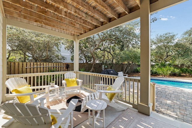 view of patio / terrace featuring a fenced in pool