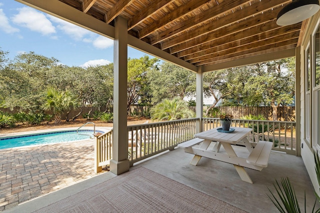 view of patio featuring a fenced in pool