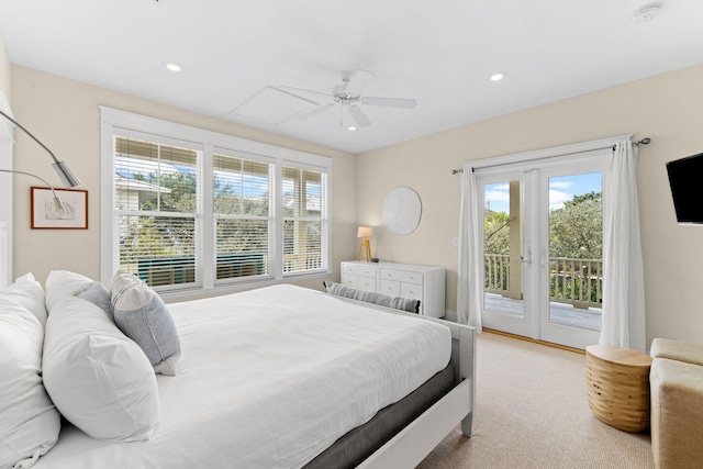 bedroom featuring ceiling fan, light colored carpet, and access to exterior