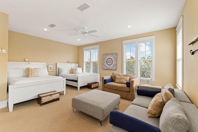 bedroom with light colored carpet and ceiling fan