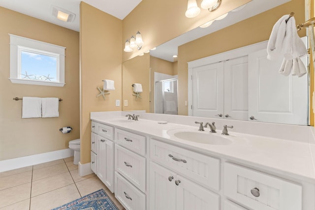 bathroom with toilet, an enclosed shower, vanity, and tile patterned flooring