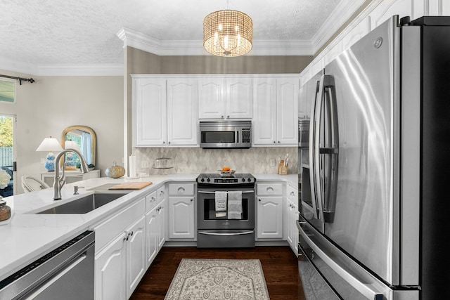 kitchen featuring appliances with stainless steel finishes, white cabinetry, sink, and dark wood-type flooring