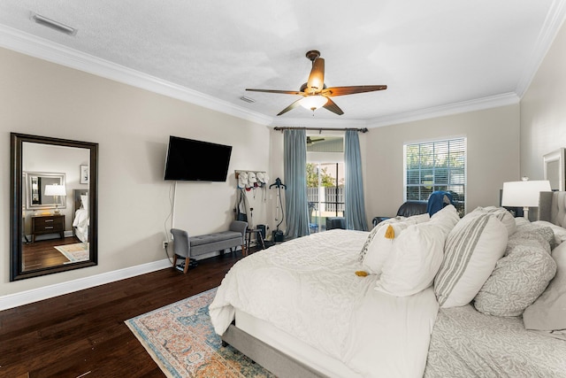 bedroom featuring dark wood-type flooring, crown molding, a textured ceiling, and ceiling fan