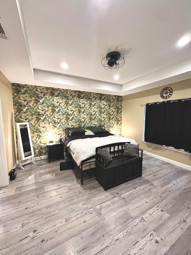 bedroom with hardwood / wood-style flooring