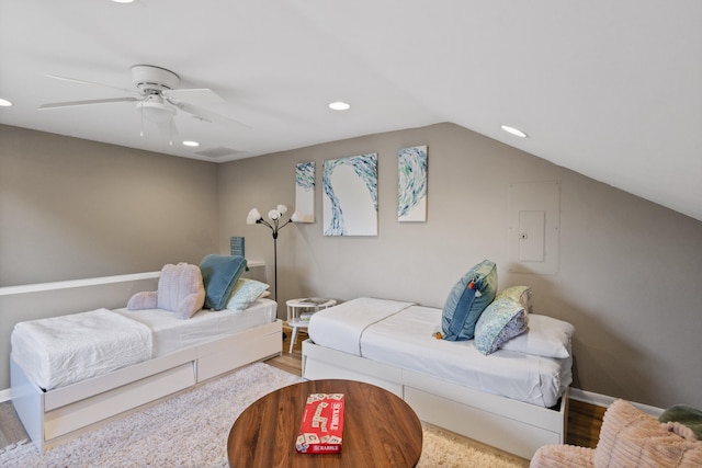 living room with lofted ceiling, hardwood / wood-style floors, and ceiling fan