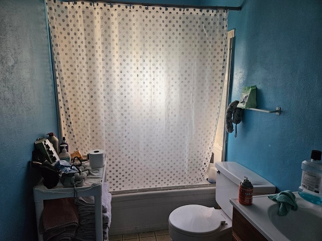 full bathroom with vanity, toilet, shower / bath combo with shower curtain, and tile patterned flooring