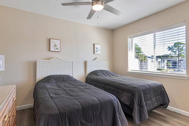 bedroom featuring ceiling fan and hardwood / wood-style floors