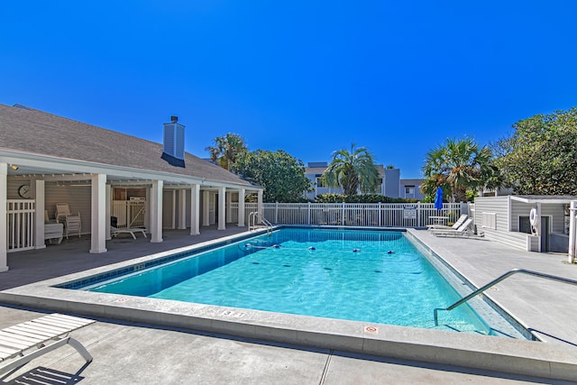 view of swimming pool with a patio area