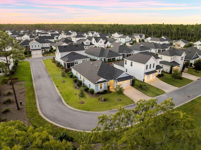 birds eye view of property with a residential view