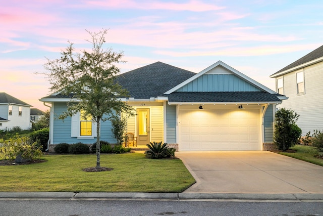 single story home featuring roof with shingles, concrete driveway, a garage, board and batten siding, and a yard