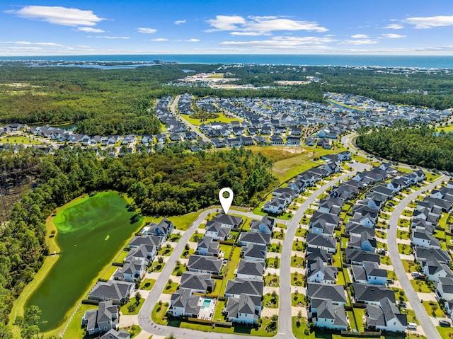 bird's eye view featuring a water view, a residential view, and view of golf course