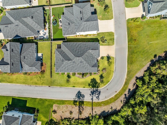 birds eye view of property with a residential view