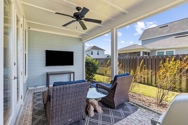 view of patio / terrace featuring a ceiling fan and fence