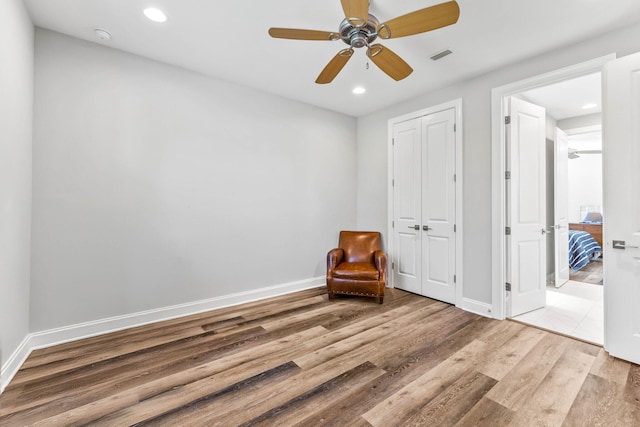 unfurnished room with visible vents, baseboards, wood finished floors, and recessed lighting