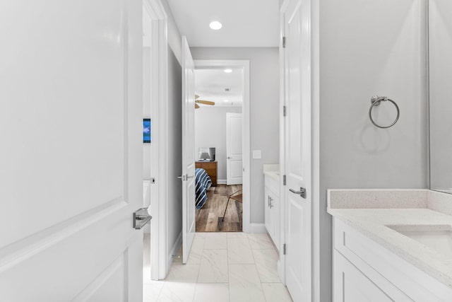 bathroom with vanity and wood-type flooring