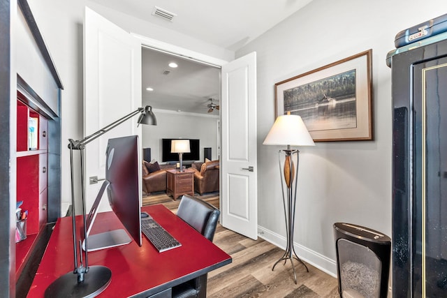 office with wood-type flooring and ceiling fan