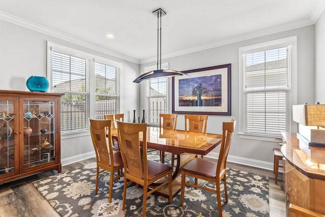 dining room featuring ornamental molding and dark hardwood / wood-style floors