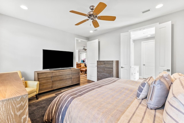 bedroom with wood finished floors, visible vents, recessed lighting, and ceiling fan
