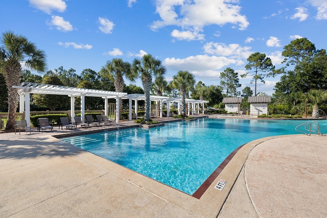 pool with a pergola and a patio