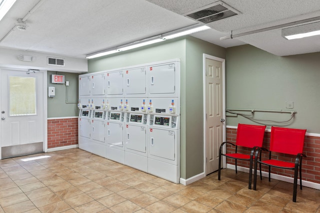 view of community with stacked washer / dryer