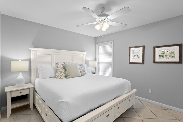 bedroom featuring light tile patterned floors and ceiling fan