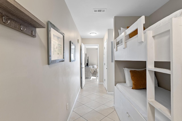 bedroom with light tile patterned floors