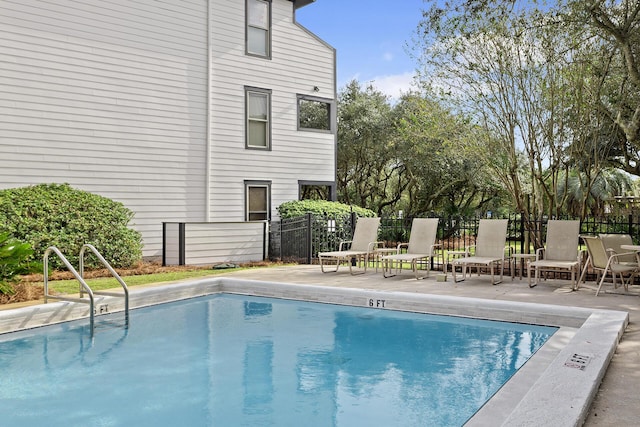 view of swimming pool featuring a patio area