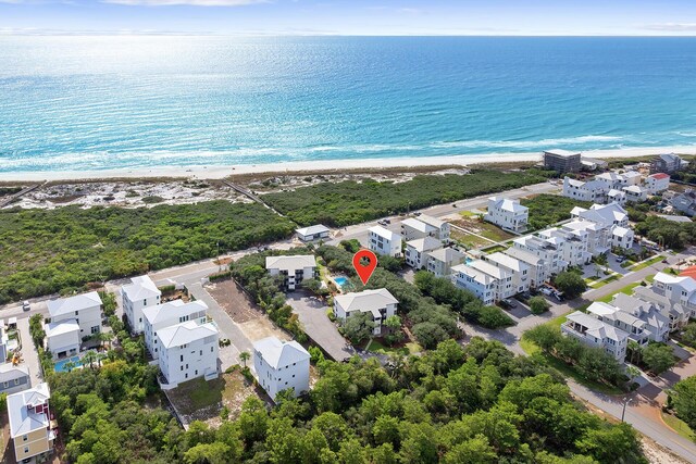 bird's eye view with a view of the beach and a water view