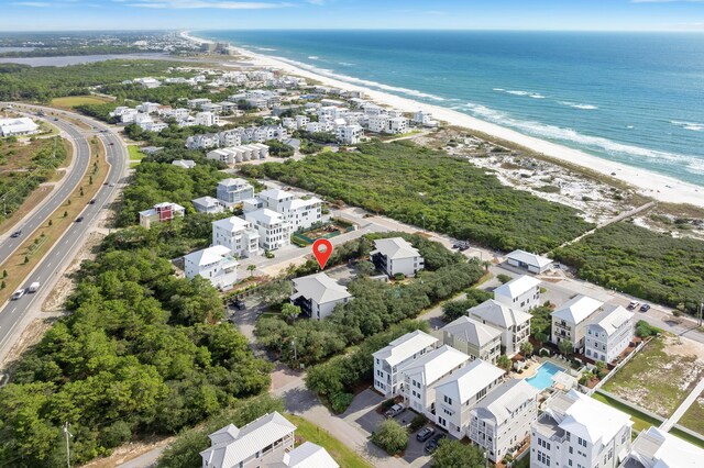 bird's eye view featuring a view of the beach and a water view