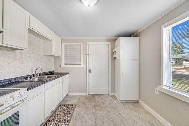 kitchen featuring ornamental molding, white electric range, white cabinets, and sink