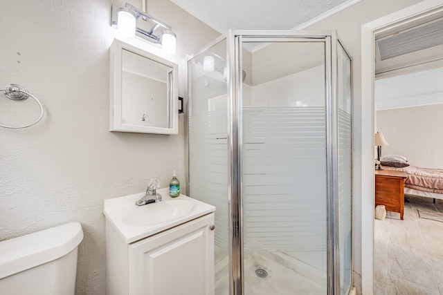 bathroom with a shower with door, toilet, vanity, crown molding, and hardwood / wood-style flooring