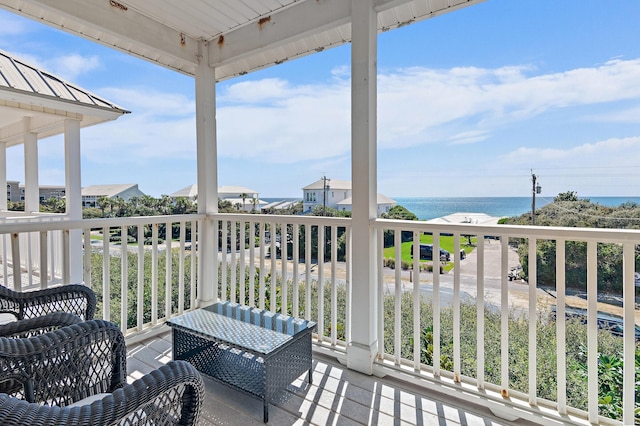 wooden deck with a water view