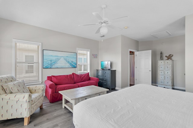 bedroom with light hardwood / wood-style floors and ceiling fan