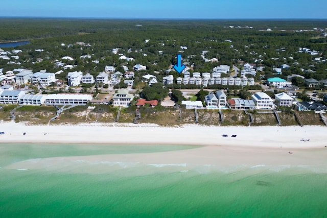 aerial view with a water view and a view of the beach