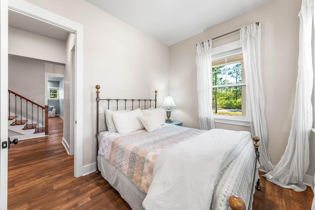 bedroom featuring dark wood-type flooring