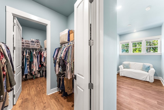 walk in closet featuring light wood-type flooring